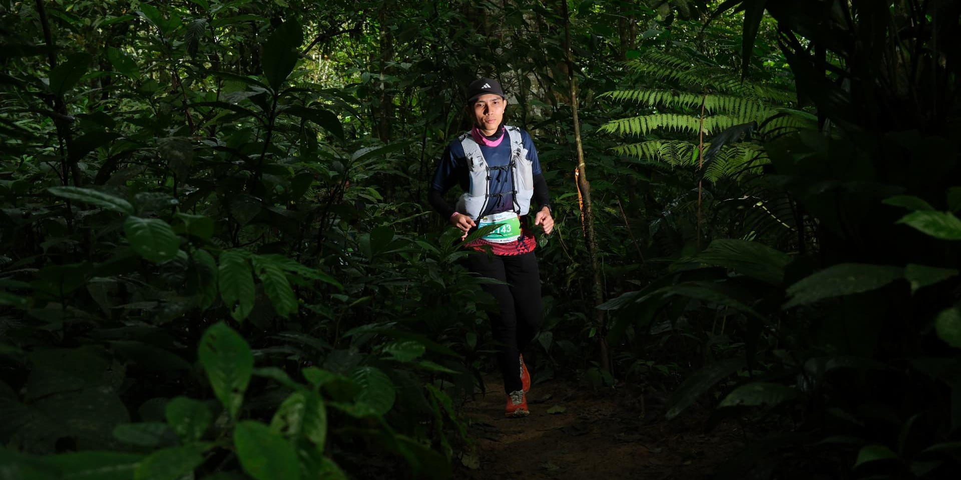 Aniq trail running on a jungle path